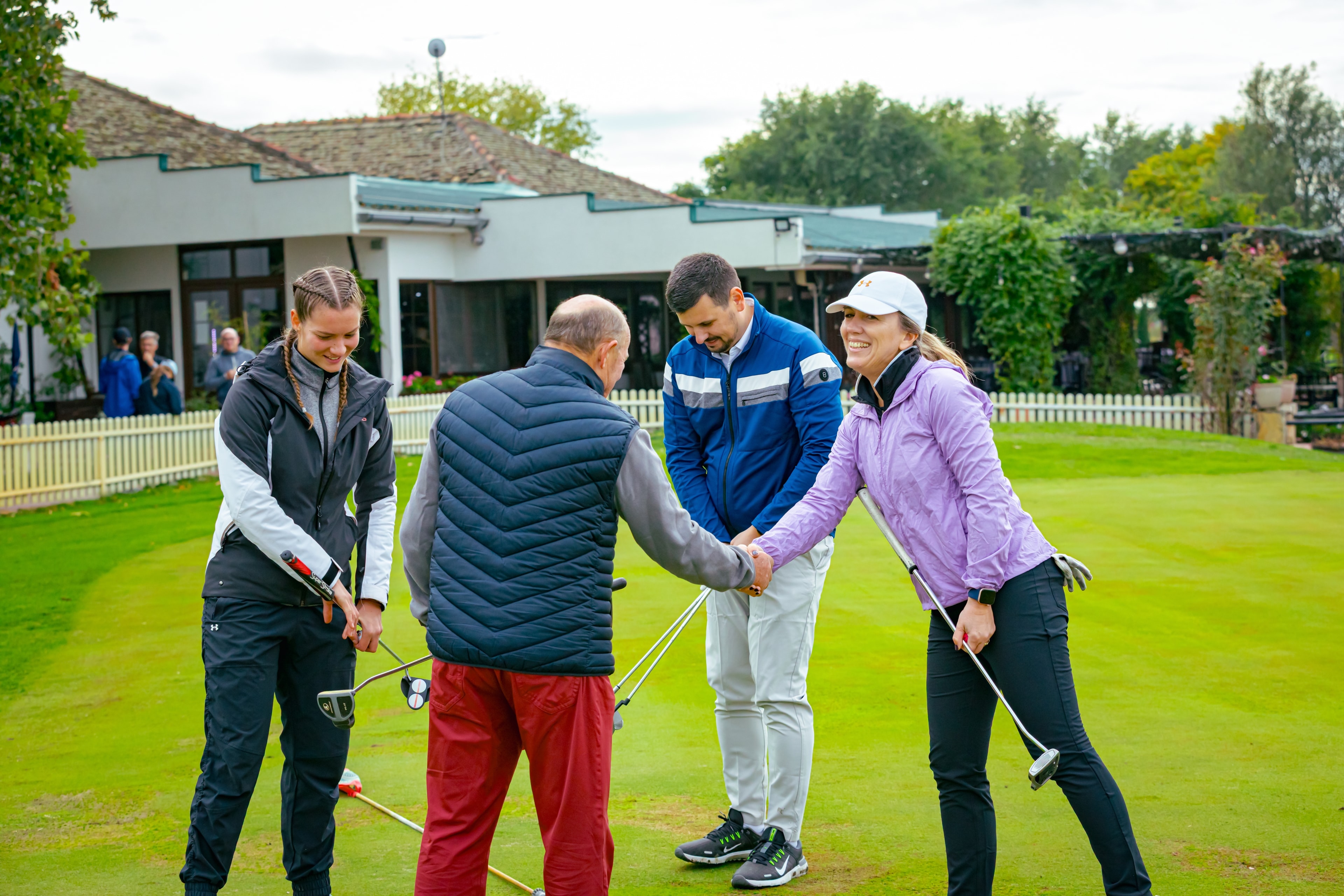 Golfers greeting each other at the clubhouse